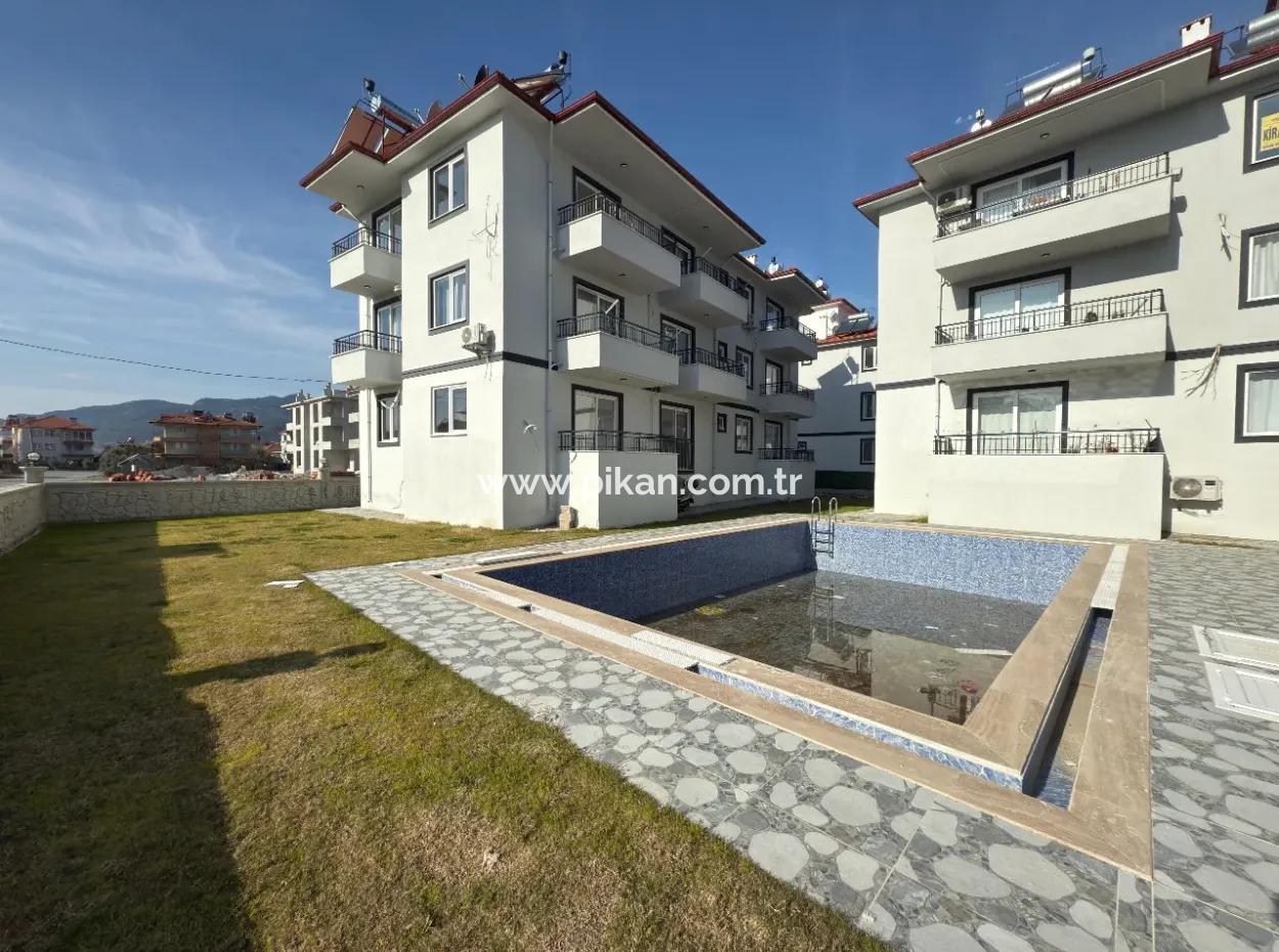 1 1 55M2 Brand New Apartment For Sale In A Complex With Pool Close To Ortaca Center.